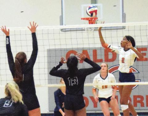 CALDWELL’S AALIYAH MASSINGILL taps the ball over the net during the Lady Hornets’ five-set battle against Sealy last Tuesday night. -- Tribune photo by Miranda Jones
