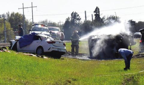 FIREFIGHTERS RESPOND TO the scene of this fatal accident on State Highway 21 West.
