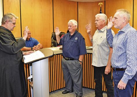 CALDWELL MUNICIPAL JUDGE Johnny Towslee swears in these Caldwell City Council members on May 13. They include, from left, Gary Easter, John Larch and Kavon Novak.
