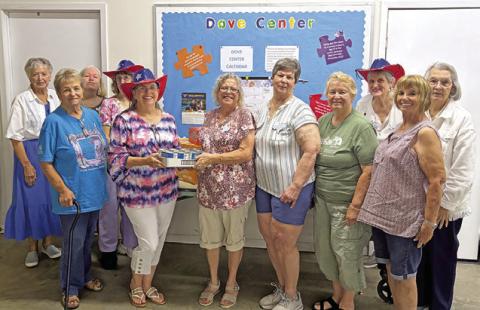 WILLIE HOBBS FROM ELIZABETH Lutheran Church food pantry was the speaker for the Lyons Education Extension Association meeting. Willie was presented with a food donation. Photo courtesy of Lyons EEA