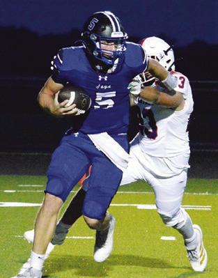 BRAYDEN MACIK carries the ball for Snook against St. Stephen’s last Friday in Snook. Tribune photo by Kim Hutcheson