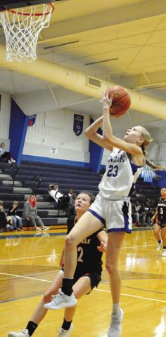 DAKOTA KIENOW PREPARES to take a shot during the Snook-Smithville game last Tuesday afternoon in Snook. Tribune photo by Denise Squier