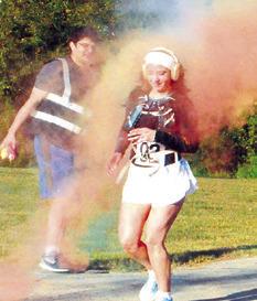 PARTICIPANTS IN Saturday’s “Debbie’s 5K Color Walk” were given color showers at various race points. The event was hosted by the Pena Brothers Memorial Saturday morning. Tribune photo by Denise Squier
