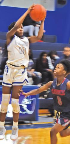 BRE’ASIA LOUIS jumps to catch a pass during Snook’s loss to Madisonville last Tuesday.
