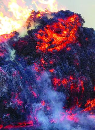 HAY BALES burn in one of the recent fires. Photo by Snook Volunteer Fire Department.