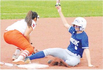 SNOOK’S TAYLOR GROCE slides safely into third base during the Snook-Somerville game last Friday night. -- Tribune photo by Denise Squier