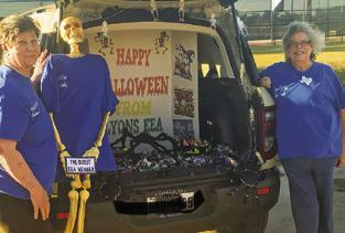 AT A LOCAL TRUNK-OR-TREAT, the Lyons EEA Club dug up their oldest member for the fun. Pictured, from left, are Brenda Kolojaco, the “oldest member” and Tammy Qualls-Tucker.
