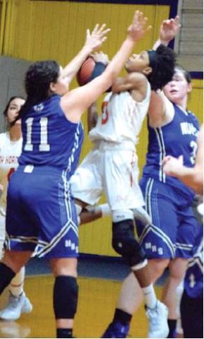 CALDWELL FRESHMAN Ja’Asia Mathis is fouled attempting a shot during Caldwell’s overtime win over Mumford at the Dime Box Basketball Tournament. Mathis scored 20 points. -- Tribune photo by Denise Hornaday