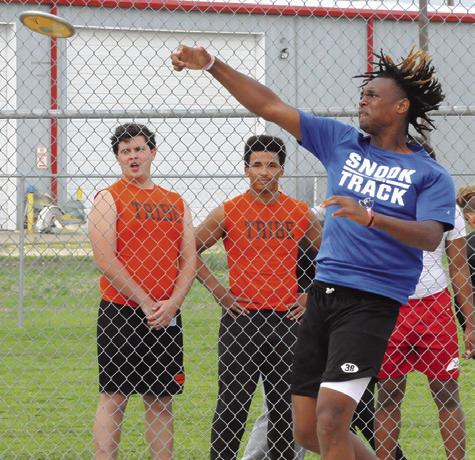 SNOOK’S JEREMIAH POWELL hurls the discus during the District 26-2A Track Meet in Snook last week. He placed fifth. Tribune photo by Denise Squier