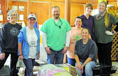 VOLUNTEERS AND STAFF AT THE feral and stray cat spay/neuter clinic in Somerville on Monday, April 7, hosted by HART and Project SNIP of Burleson County. Tribune photo by Denise Squier