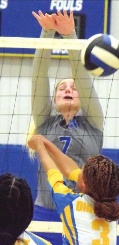 ALEXIS MACIK BLOCKS a hit by a Dime Box player during the Snook-Dime Box district match last week in Dime Box.