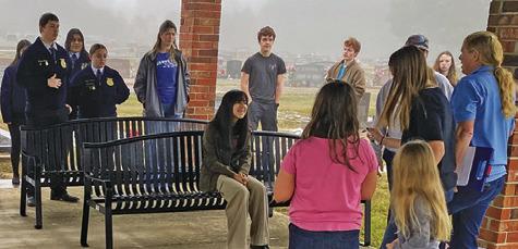 MEMBERS OF THE SNOOK FFA joined Snook residents to place swags on veterans’ graves on Saturday at the Snook Cemetery as part of the “Wreaths Across America” program. Photo courtesy of Steve Tunnell