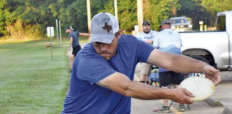 A DISC GOLFER warms up on Saturday at the grand opening tournament for Caldwell’s Disc Golf Course at John E. Hejl Park at Davidson Creek. More than 50 disc golfers played in the tournament.