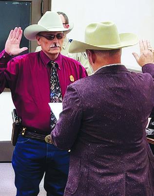 BURLESON COUNTY Sheriff Gene Hermes is sworn into office on Jan. 1 by Burleson County Judge Keith Schroeder.