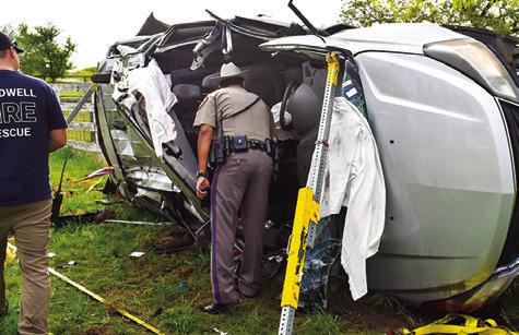 A DPS TROOPER investigates at this Monday morning accident on F.M. 60 West near Park Road 4. The driver was flown from the scene by an AirMed helicopter crew. No details were available at press time.