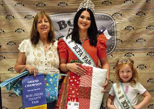 BEKKI CAMPISE WON GRAND IN Adult Quilts and Creative Arts and Crafts. Also pictured are Fair Queen Kodi Hitchcock and Little Miss Taytum Hohlt. Tribune photo by Sabine Lazo