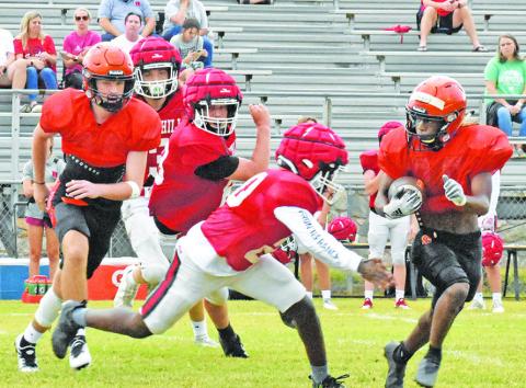 SOMERVILLE’S HERSCHEL CONWAY carries the ball against Rosehill Christian School. Also pictured is blocker Kutter Rohrbach.