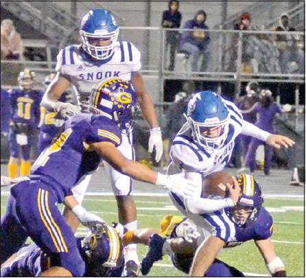 DAVID DAVILA FIGHTS for extra yardage against Granger last Friday in Rockdale. The Bluejays lost 36-12 in the bi-district playoff to finish the season at 4-7. -- Tribune photo by Roy Sanders