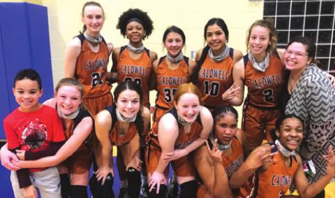THE LADY HORNETS CELEBRATE after getting their first district win of the season, beating Rockdale 47-37 last Tuesday in Rockdale.
