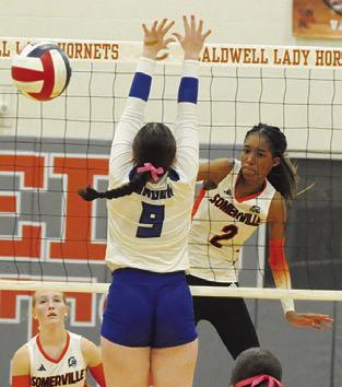 KARYS ELLIS gets a kill past Kalyn Cooper during the Somerville-Snook play-in match for play-off seeding on Monday in Caldwell.