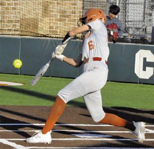 KYSEN TONEY hits the ball during the Lady Hornets big 19-0 win over Manor Net Tech last week. -- Tribune photo by Denise Squier