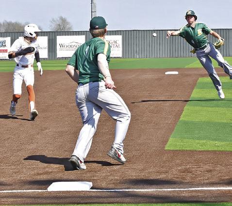 BLANE CASTANEDA of Caldwell runs for third as Lexington players try to tag him. -- Tribune photo by Roy Sanders
