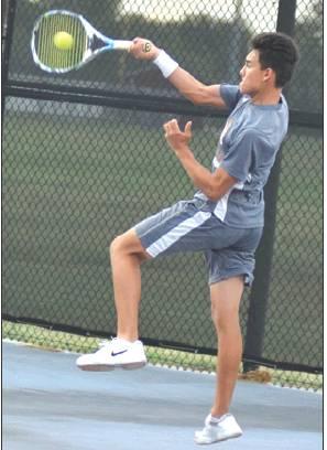 ADOLFO GAUCIN hits the ball from behind the backline during Caldwell’s win over Cameron. -- Tribune photo by Denise Hornaday