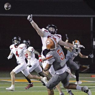 CALDWELL’S JOHN FRYREAR hurls this pass against the Lorena defense last Friday in the district opener in Caldwell. Tribune photo by Kim Hutcheson