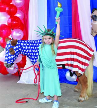 LYNLEE KOCUREK IS with Pokey on Saturday at the Burleson County Fair Pet Show at the fair pavilion. Tribune photo by Roy Sanders