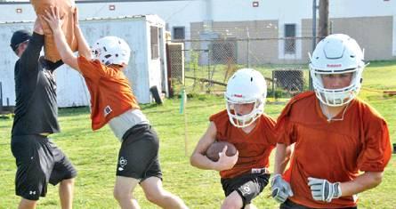 THE CALDWELL HORNETS FOOTBALL team works on these drills on Monday morning, Aug. 5, on the first day of fall workouts for the 2019 season. The Hornets are getting ready for the Aug. 30 opener with Edna. -- Tribune photo by Roy Sanders