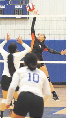 SOMERVILLE’S GABBY JACKSON reaches for the kill during the Lady Yeguas’ win over Dime Box. -- Tribune photo by Denise Squier