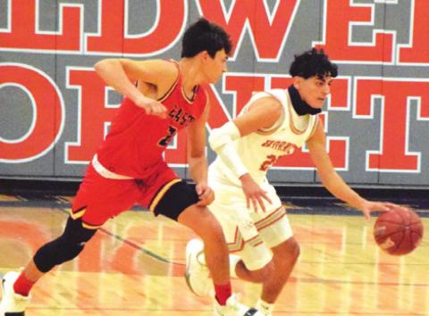 IAN RECIO DRIBBLES the ball for Caldwell against Victoria East.
