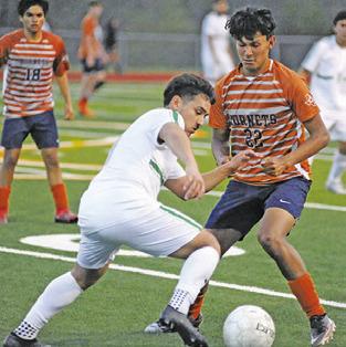 JEFFRY TOBIAS and a Taylor player fight for possession of the ball during the Caldwell-Taylor game on Friday at Hornet Field.