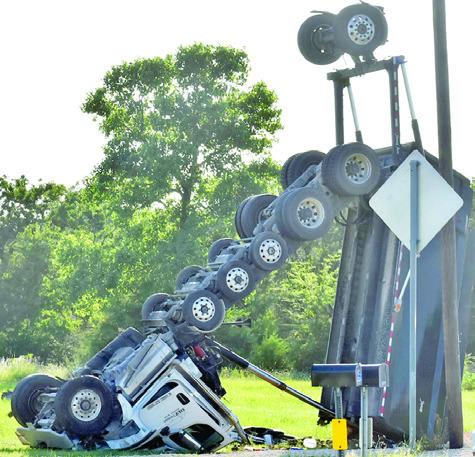 THIS DUMP TRUCK overturned on Friday, June 6, in an accident off State Highway 36 South. The driver was flown to a Temple hospital. Tribune photo by Roy Sanders