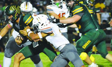 ZANE BROWN OF Caldwell moves in for a tackle against Lexington last Friday in Lexington. The Hornets open district Friday at Giddings. Tribune photo by Roy Sanders