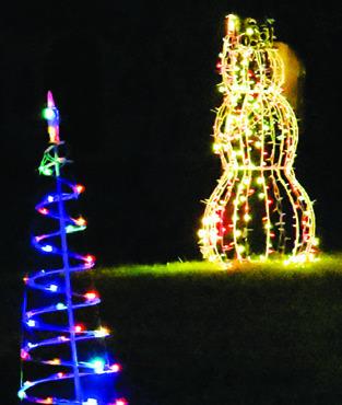 CHRISTMAS LIGHTS like these are visible each night on the Burleson County Courthouse lawn for pedestrians and motorists.