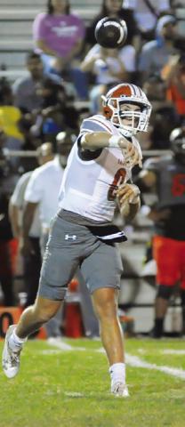 COY BECKA of Caldwell hurls this pass against Gonzales last Friday.