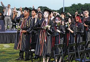 SOMERVILLE CLASS OF 2026 and those in attendance at Friday night’s graduation ceremony sing the school song. Tribune photo by Denise Squier