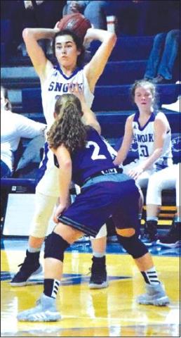 NATALIE VACHA LOOKS to pass the ball during the Lady Jays’ win over Number 23 Douglass Friday night in Snook.