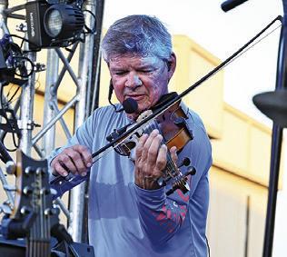 EVERYONE LOVED the fiddle during Texas Unlimited Band’s performance at Main Street Caldwell’s “Summer Concert Series.” Tribune photo by Denise Squier