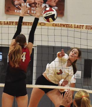 LYDIA GIESE gets the ball past a BVCHEA Homeschool blocker during a Caldwell win in 2025. During this match, Giese reached 1,000 career assists. Tribune photo by Roy Sanders