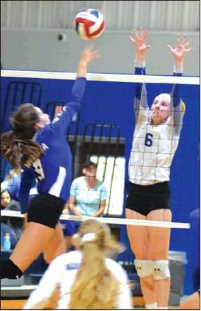 SNOOK’S JAYCIE BRISCO leaps to block a hit from a Navasota player during the annual Snook Volleyball Tournament last week.
