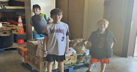 ON SATURDAY, FEB. 1, Caldwell Pack 181 collected nonperishable food for the Elizabeth Lutheran Church Pantry. They collected 250 pounds of food. Pictured, from left, are Jake-Ryan Baron, Nicholas Sandage and Lucas Sandage. Photo courtesy of Pam Cantey