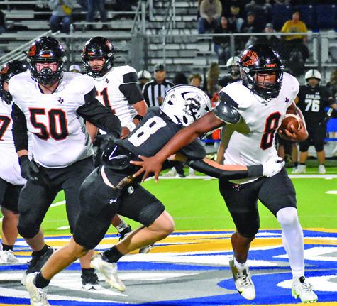 JA’KEITH DANIELS CARRIES the ball for Somerville against Junction in the bi-district playoff last Friday.
