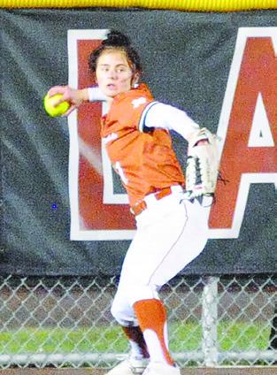 BREANN SIMS sets to throw the ball from the outfield after a Leon batter hit the ball to the warning track. -- Tribune photo by Denise Squier
