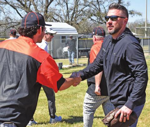 SOMERVILLE HEAD COACH Noah Leist greets Yegua alum Jeremy Fikac at the RTC game. -- Tribune photo by Roy Sanders
