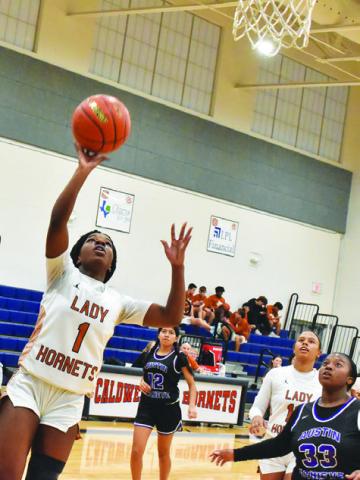 CALDWELL AMOREE DENSON attempts a layup during the Lady Hornets’ victory over Austin Achieve last Friday night at Hornet Gym.