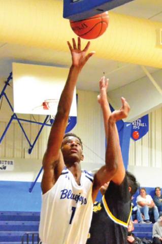 MA’DARIUS HAMILTON takes a shot for Snook as this North Zulch player defends.