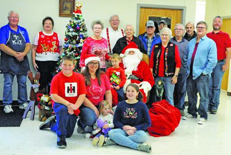 ST. BENEDICT KJT SOCIETY #100 sponsored “Breakfast with Santa” on Saturday, Dec. 4, at St. Mary Catholic Church’s Parish Activity Center, featuring a breakfast of pancakes and sausage and photo opportunities with Santa Claus. Tribune photo by Denise Squier