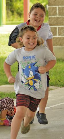 CHILDREN ENJOYED activities during last Thursday’s Harrie P. Woodson Memorial Library’s “Hot on the Trail” event. Tribune photo by Kimberly Hutcheson